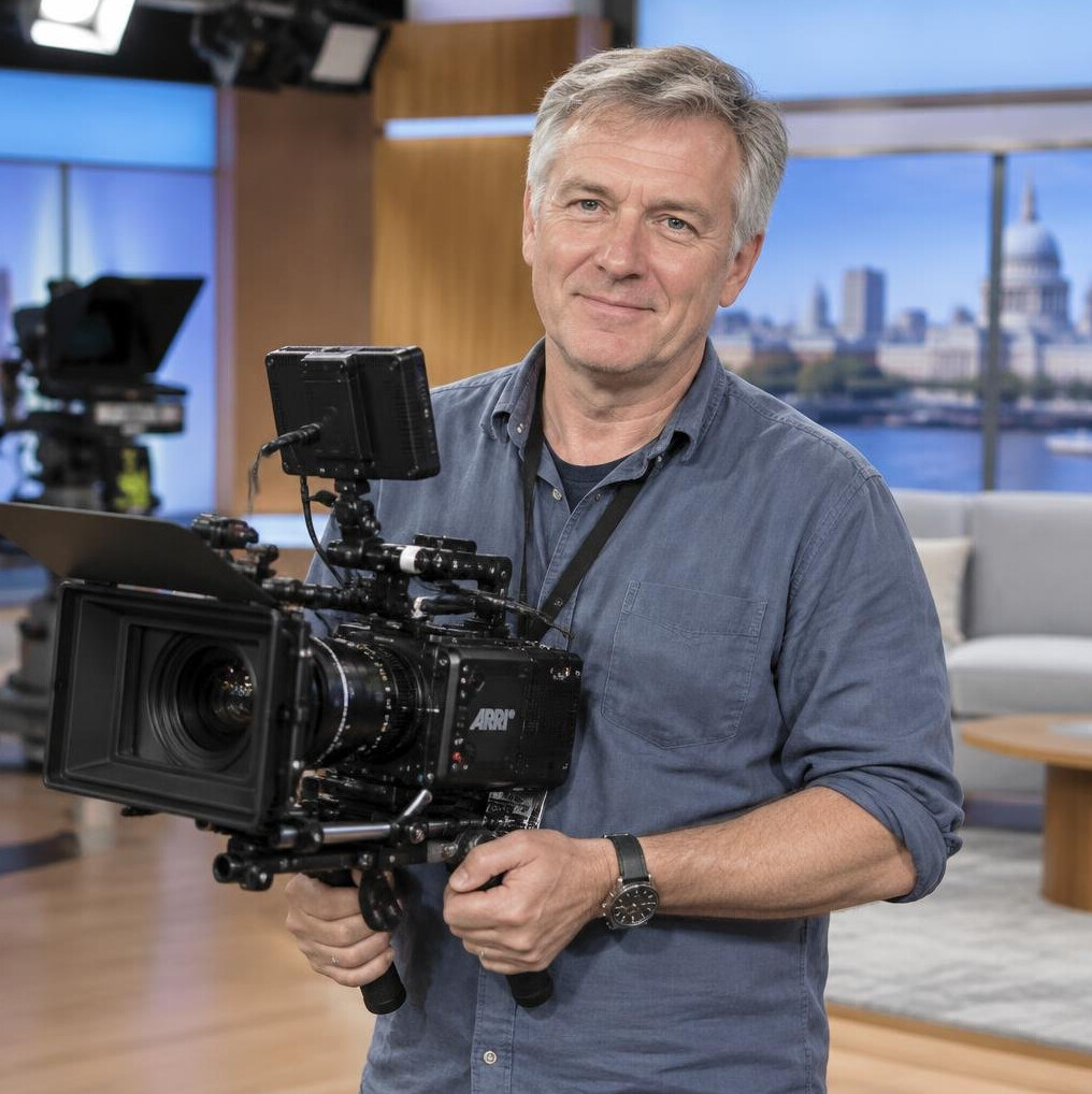 Camera coach holding a cinema camera rig