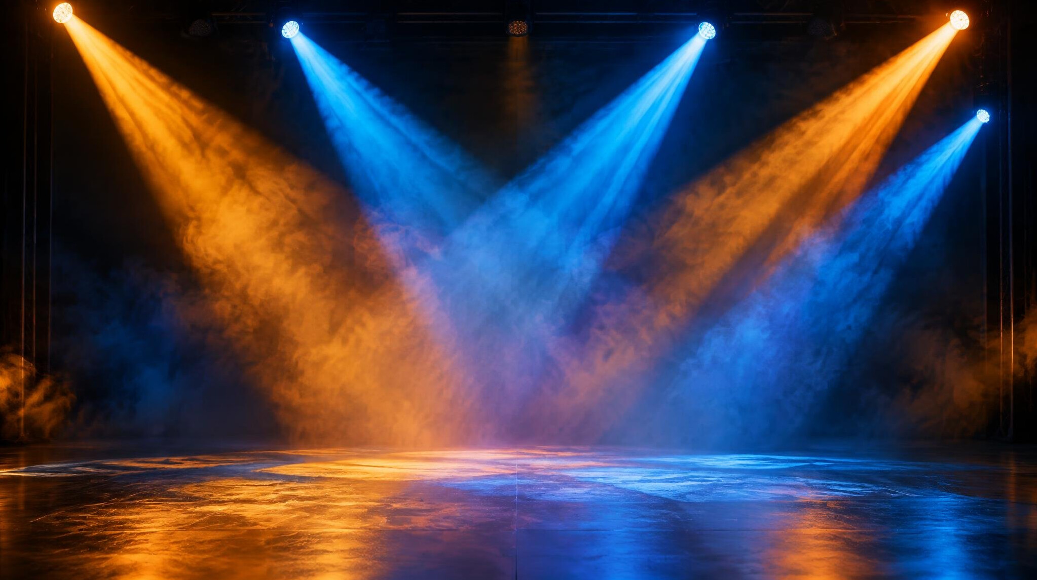 Dramatic stage lighting beams crossing an empty stage